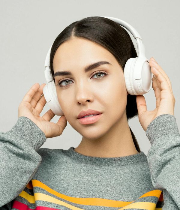 Young woman relaxing with her eyes closed in soft light